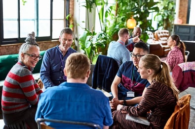 people sitting and having a conversation